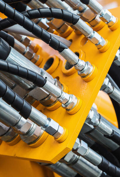 pipes and the hydraulic system of the tractor or excavator.Focus on the left side of the frame on the pipes